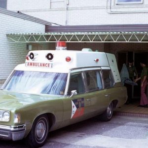 Pontiac Superior Ambulance at an area hospital.  Early uniforms were simply kelly green shirts and bell bottoms...
Notice that this unit had only one 
